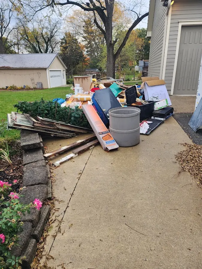 Dumpster being loaded with debris for 3 Yard Dumpster Rental in Bridgewater